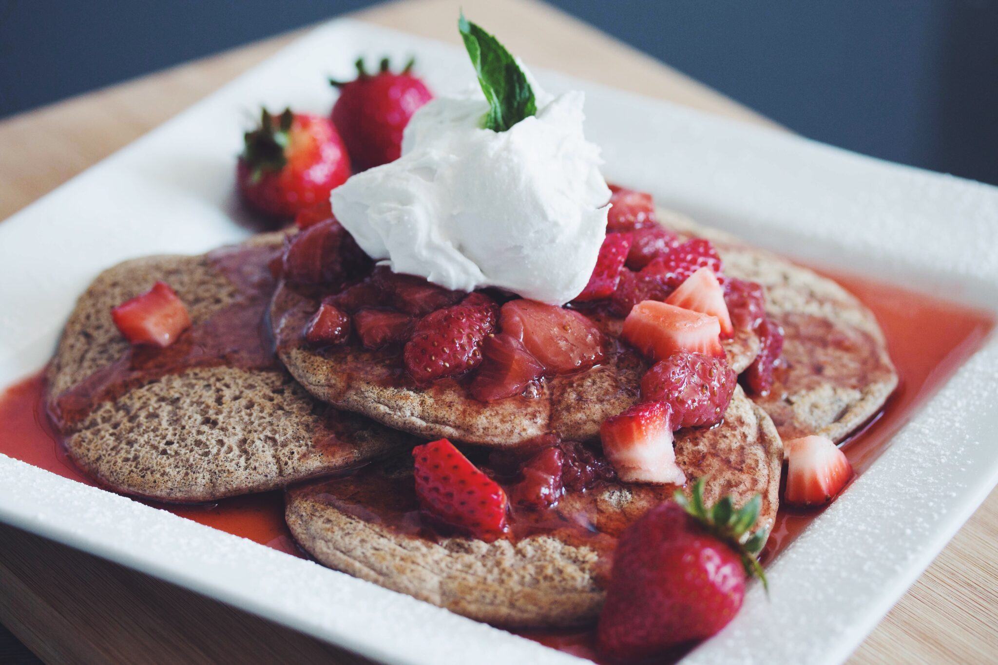 buckwheat pancakes with brandied strawberries & coconut whip