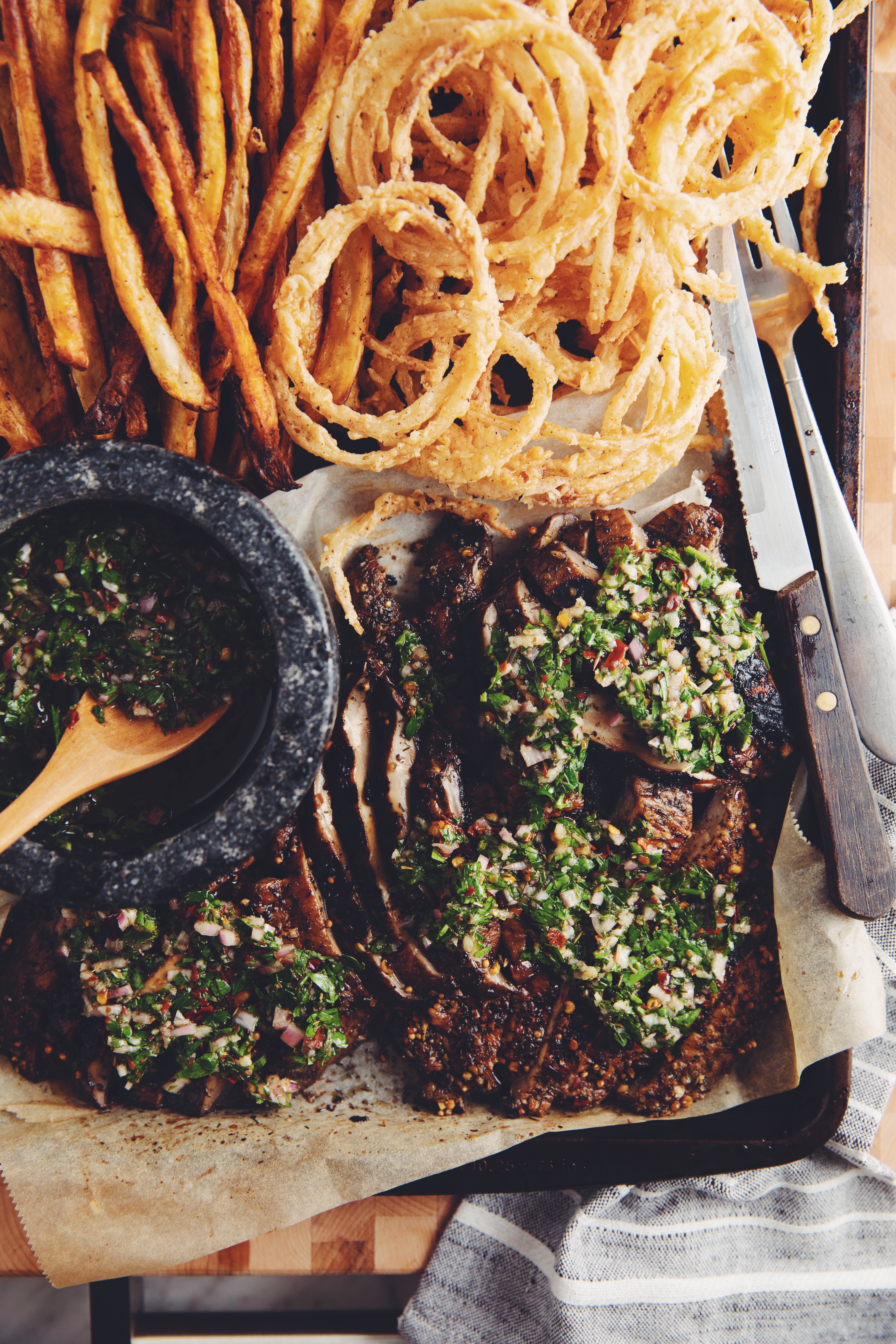 grilled portobello steaks with chimichurri & onion strings