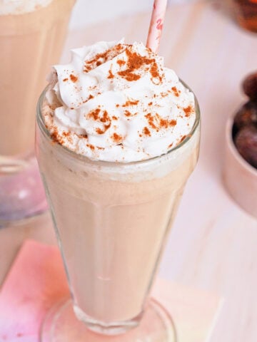 date shake with coconut cream in a glass