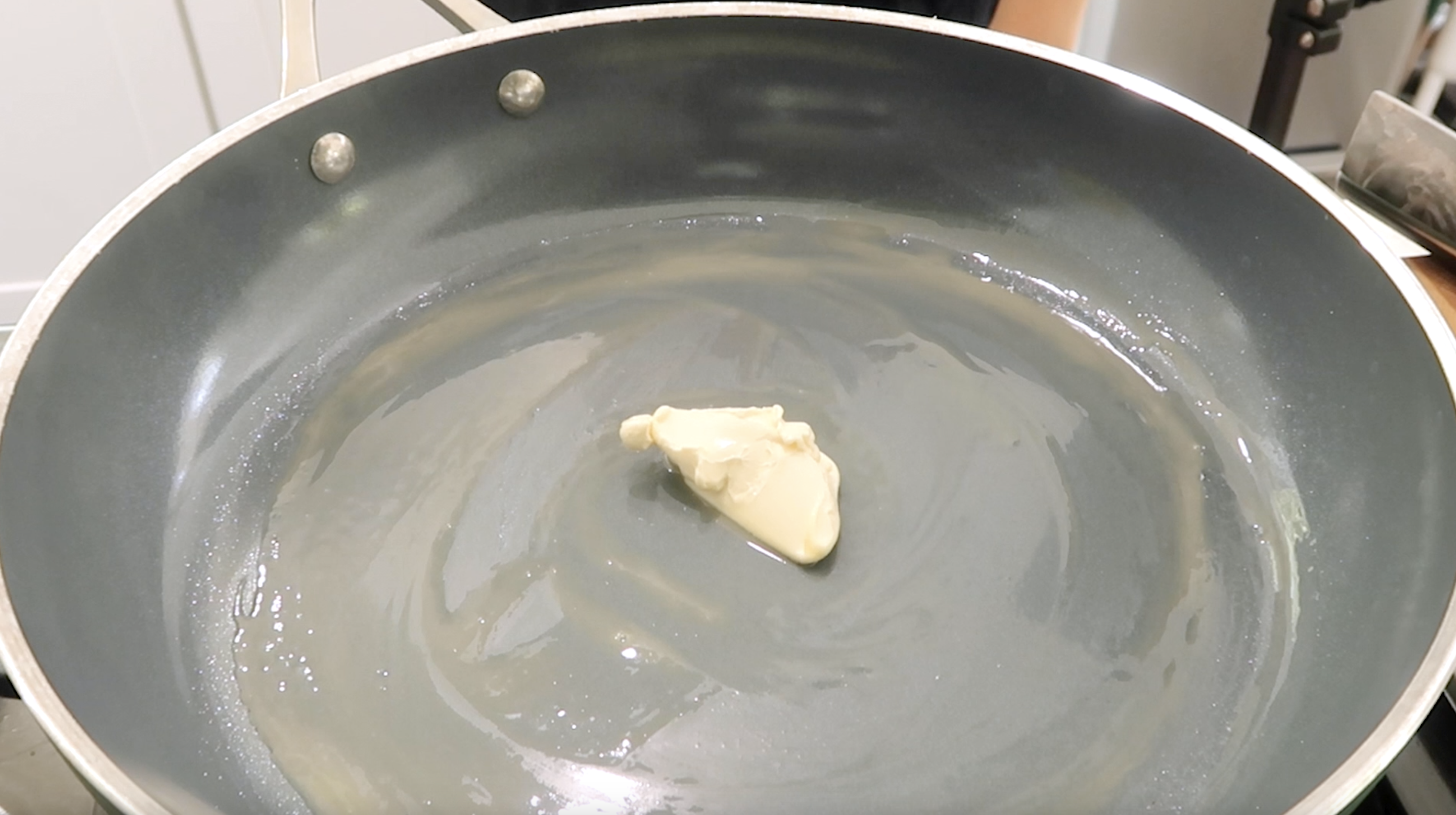 vegan butter swirling in a hot pan