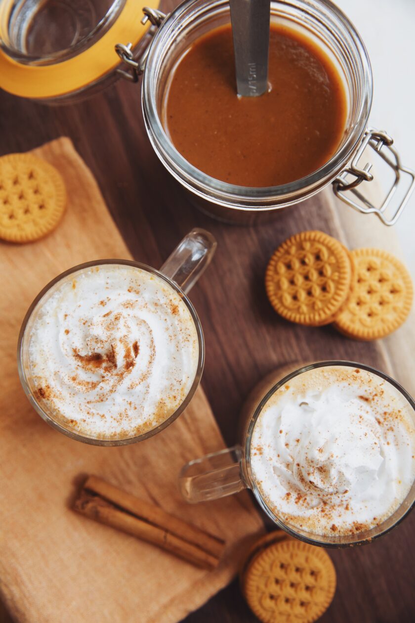 homemade pumpkin spice latte syrup with two lattes in mugs