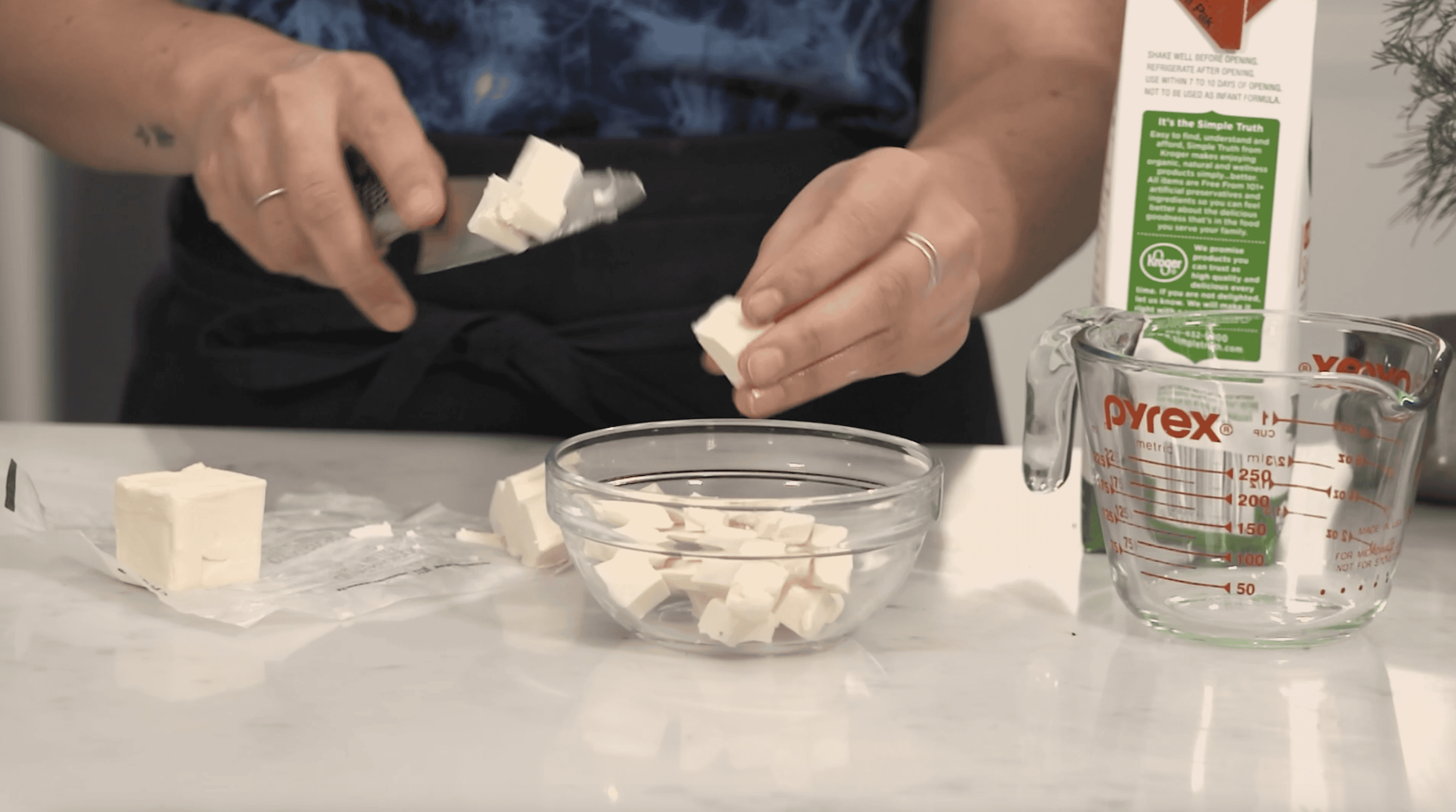 vegan butter being cut into cubes and added to a bowl
