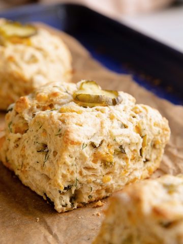pickle cheddar biscuits on a baking tray