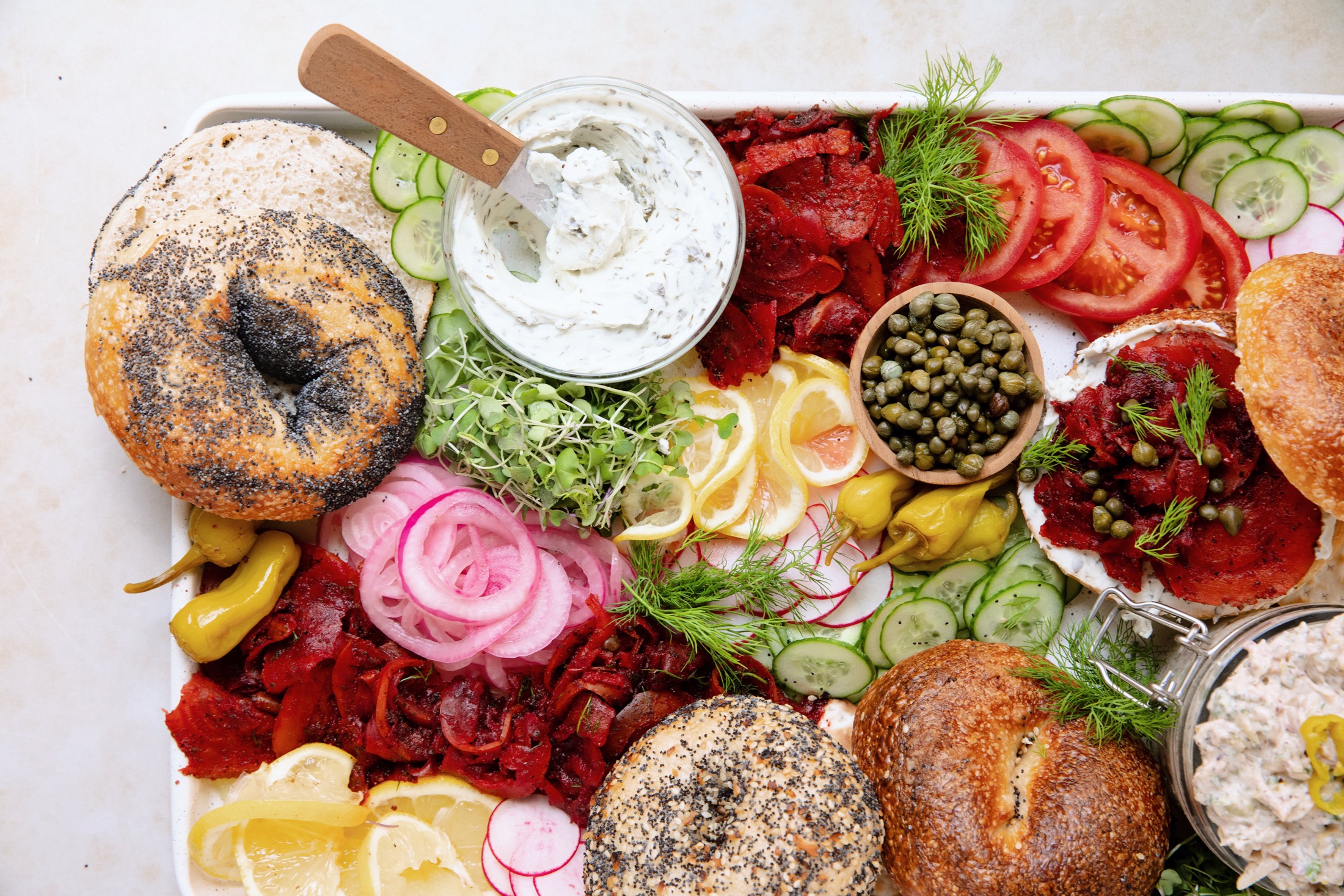 vegan bagel board with beet lox and whitefish spread