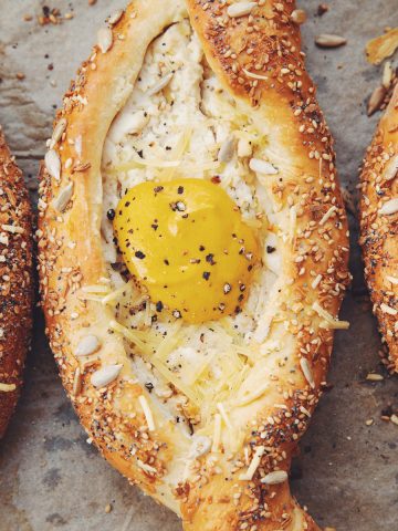 close up of vegan Georgian cheese bread with egg yolk sauce