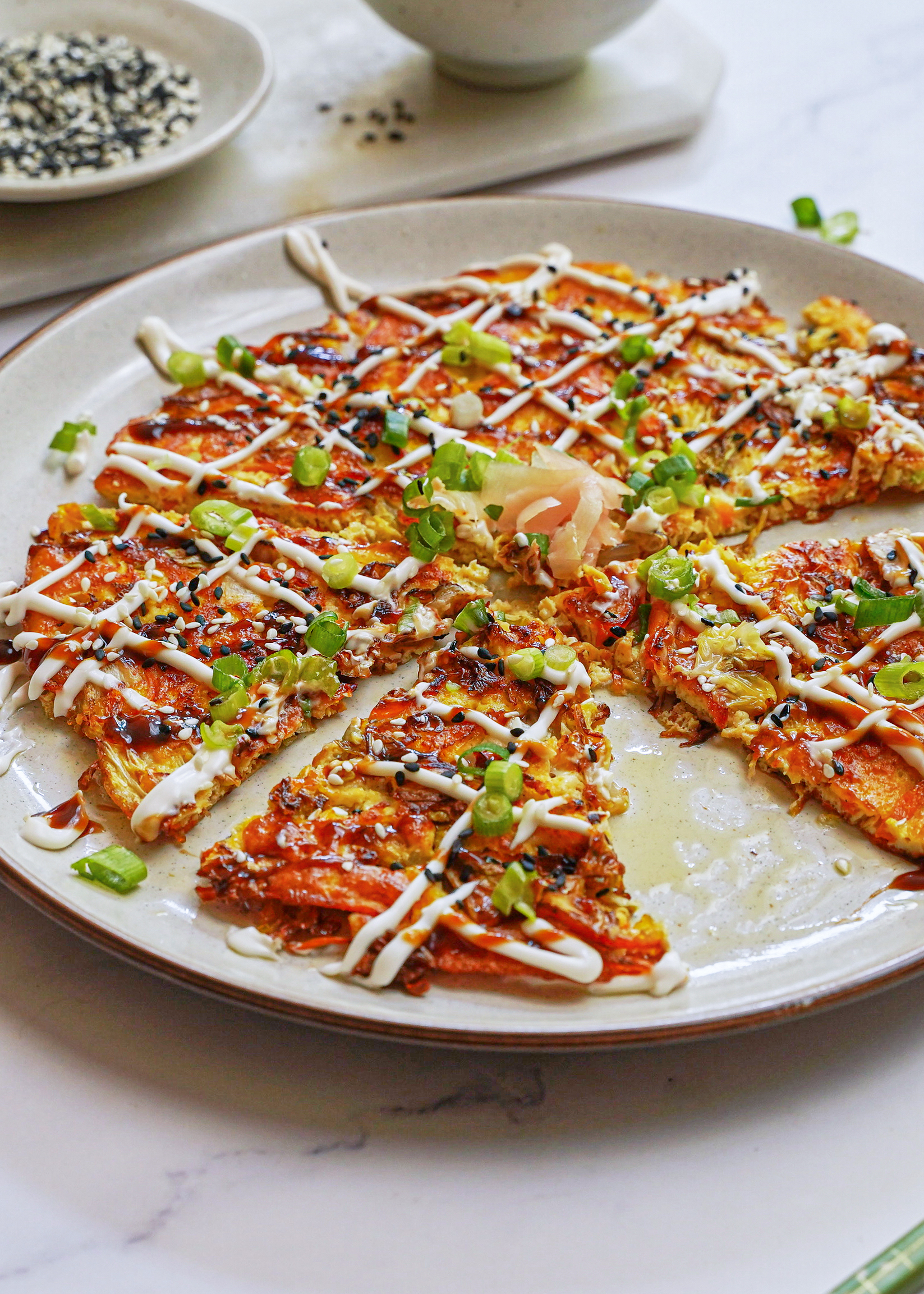 sliced vegan okonomiyaki showing soft interior texture