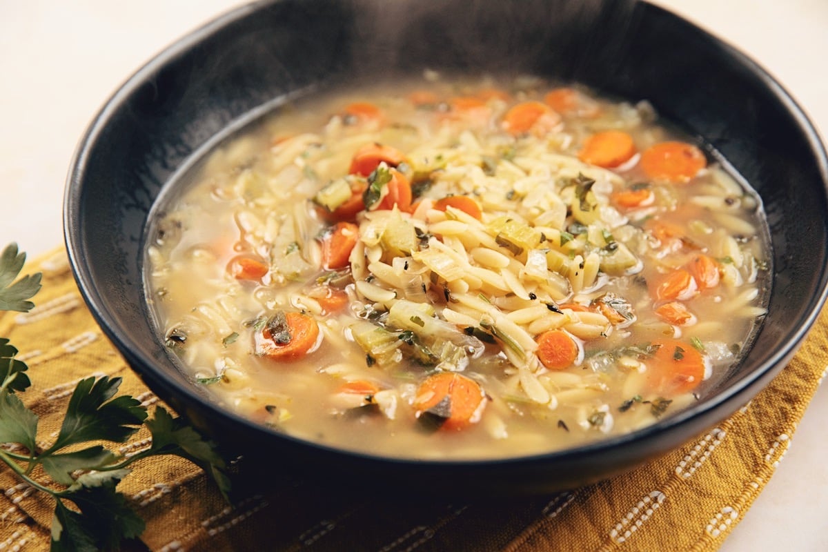 bowl of lemony orzo vegetable soup