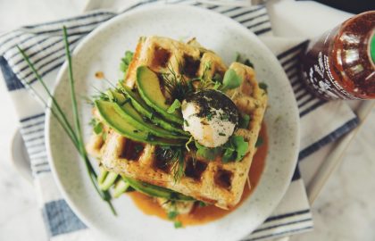 green waffles with spinach, avocado and sriracha maple syrup